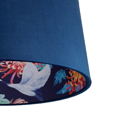 close up of the Navy blue velvet lampshade with japanese craneslining in blue