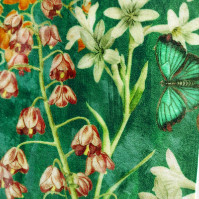 emerald green meadow velvet lampshade close up, showing the green background, flowers and butterfly