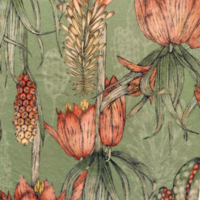 close up of Exotic Flora Velvet Cushion in Sage Green, showing the sage green background pattern with orange tropical flowers