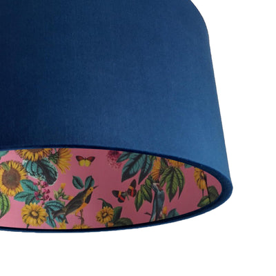 close up of the navy blue lamp shade with pink sunflower llining