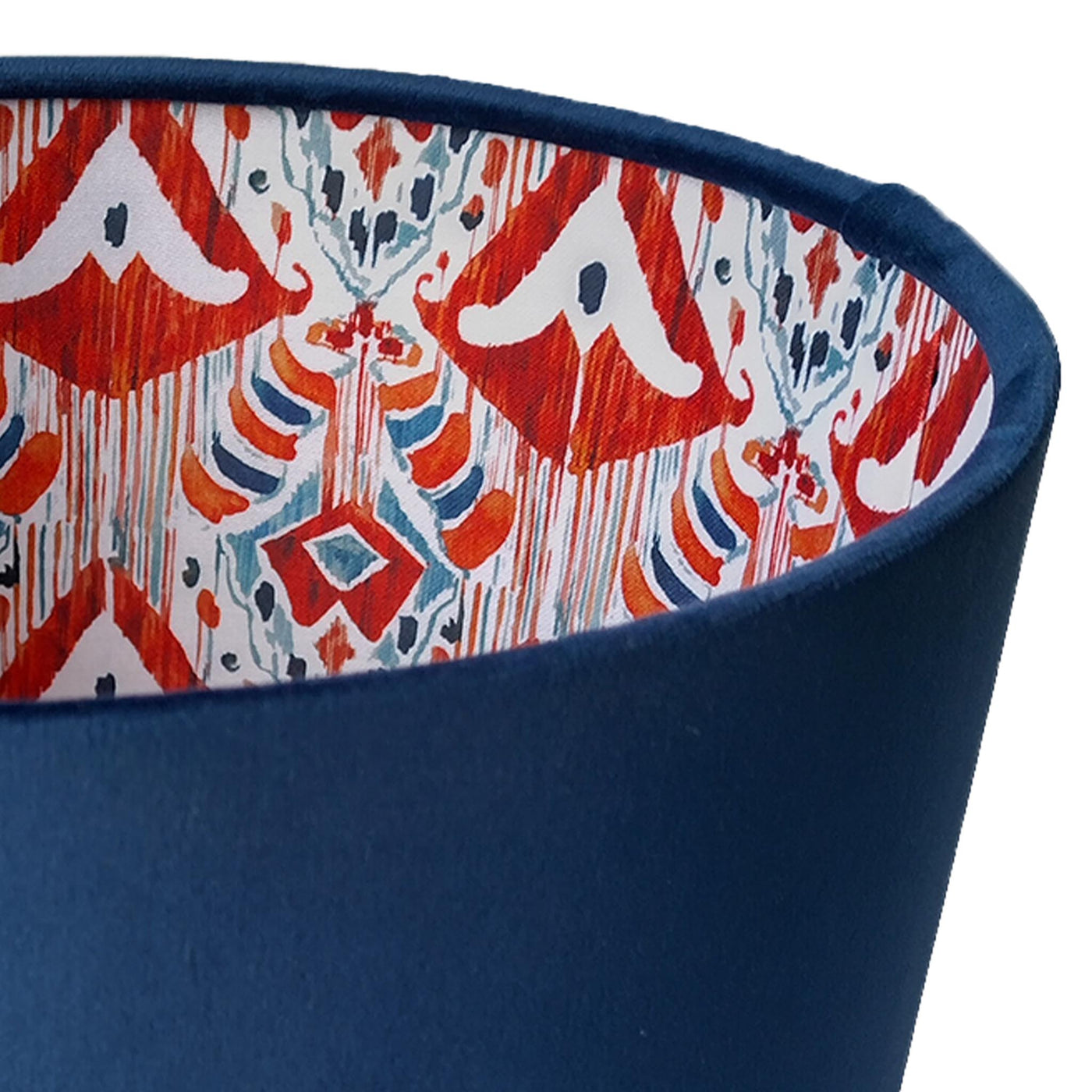 close up of the Navy Blue Velvet Lampshade with Red Ikat Fabric Lining