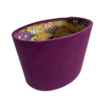 Oval lamp shade in mulberry purple velvet with purple and gold tropical lining, side picture showing seam is on the right hand side.