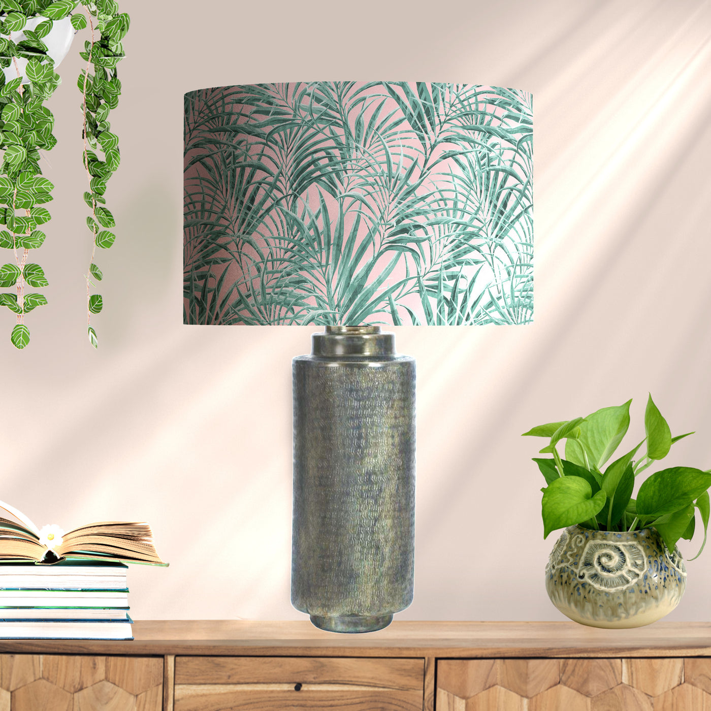 Palms Delight Lampshade with Mirror Gold Lining, pictured on metallic lamp base in living room setting