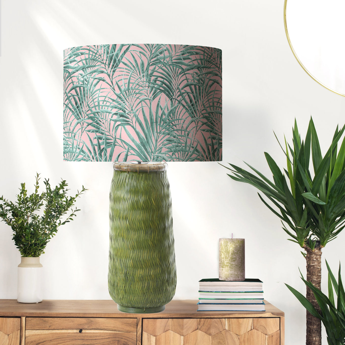 Palms Delight Lampshade with Mirror Gold Lining, pictured on green raffia lamp base in living room setting