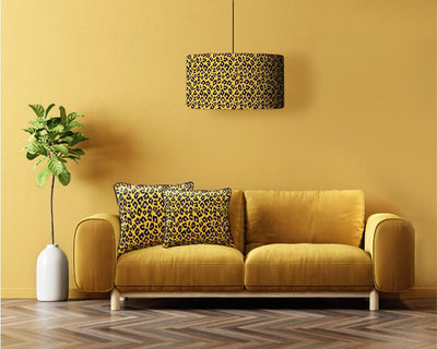 Fearless leopard lampshade with matching velvet cushions in mustard yellow living room